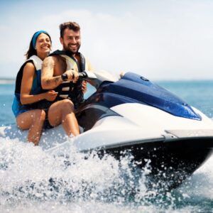 Couple enjoying a safe and affordable jet ski tour.